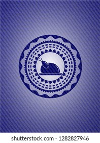 chicken dish icon inside badge with denim texture