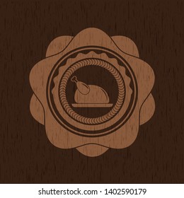 chicken dish icon inside badge with wooden background