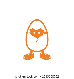 Chicken in the egg looks through the crack in the shell.