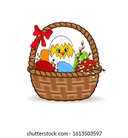 Chicken hatched from an egg in a basket with Easter eggs and pussy-willow twigs