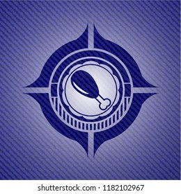 chicken leg icon inside badge with denim background