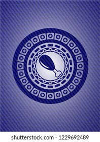 chicken leg icon inside badge with denim background