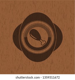 chicken leg icon inside badge with wooden background