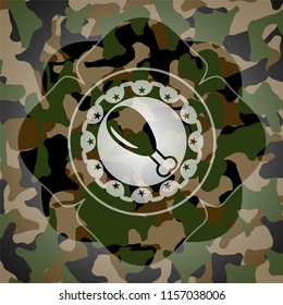 chicken leg icon inside camouflaged emblem