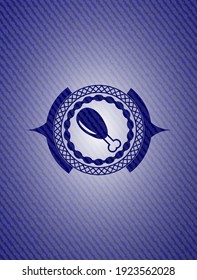 chicken leg icon inside emblem with denim high quality background. 