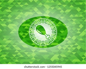 chicken leg icon inside green emblem with mosaic background