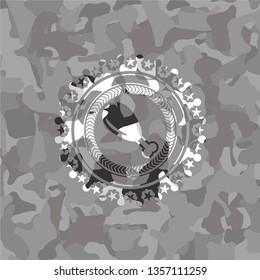 chicken leg icon inside grey camouflage emblem