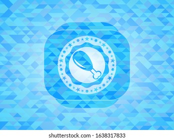 chicken leg icon inside light blue emblem with mosaic background