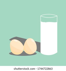 Chicken and milk eggs isolated on  green background