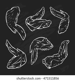 Chicken wing drawing on a black background. Hand drawn chicken wing illustration. Great for menu, poster or label.