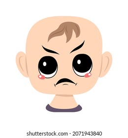 Child with angry emotions, grumpy face, furious eyes. Head of cute baby with furious expression