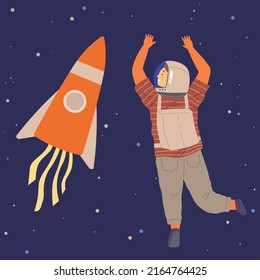 Child astronaut in cardboard or plastic rocket outfit dreams about space. Creative boy in self made costume imagines flying in sky. Kid playing space explorer. Guy in costume near huge rocket