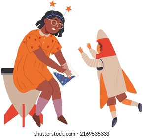 Child astronaut in cardboard or plastic rocket outfit. Creative boy in self made costume playing with mother. Mom and son playing in space explorers. Family at holiday party in cosmic style