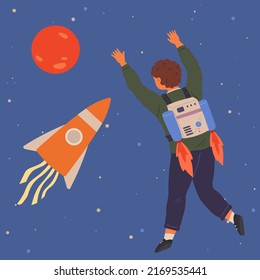 Child astronaut in cardboard or plastic rocket outfit dreams about space. Creative boy in self made costume imagines flying in sky. Kid playing space explorer. Guy in costume near huge rocket