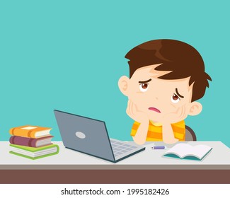 child boy bored of studying in front of the laptop. Concept of tired kid from home e-learning or online education