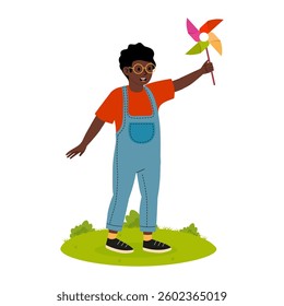 Child with colorful pinwheel enjoying a sunny day in a grassy park