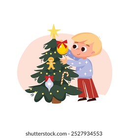 Niño decorando un árbol de Navidad. Un niño se prepara para las Navidades.