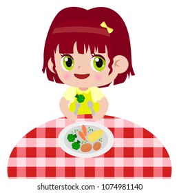 The child eats food at the dinner table. Useful balanced food. Organic products.
