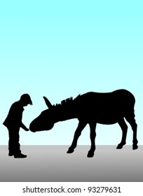 child feeding a donkey