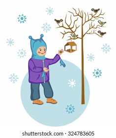 Child feeding titmice and sparrows in winter