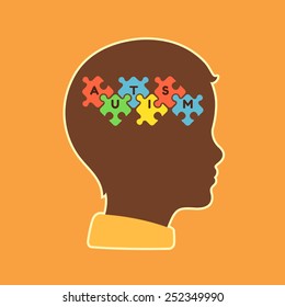 child head profile silhouette with jigsaw puzzle symbolizing autism spectrum disorders