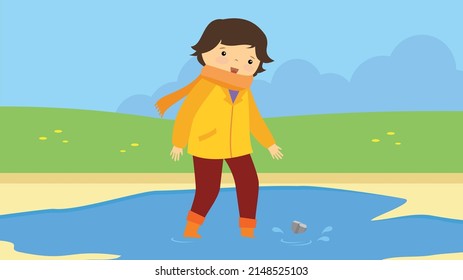 child jumping in puddles after rain