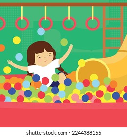 A child plays in a dry pool in a children's room. Child having fun
