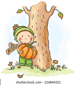 Child with a pumpkin on an autumn day