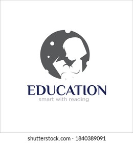 child reading book at the night for education logo or school