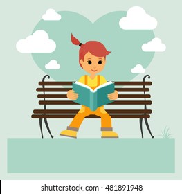 Child reading a book in a park. Learning and education. Education and fun.