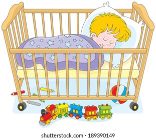 Child sleeps in a bed in a kids bedroom with toys