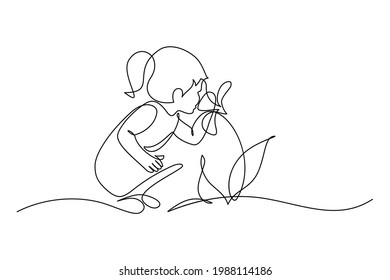 Child smelling flower in