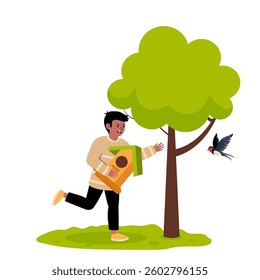 Child smiling while placing a birdhouse next to a tree in a sunny garden setting