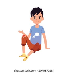 Child with wounded knee sitting on the floor, flat vector illustration isolated on white background. Little boy cartoon character got injury or trauma.