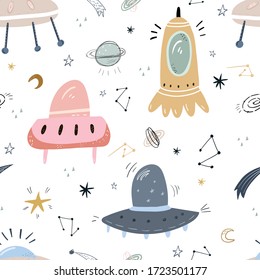 Childish seamless pattern with aliens, ufo in cosmos. Perfect for kids apparel,fabric, textile, nursery decoration,wrapping paper