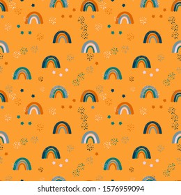 Childish seamless pattern with cartoon rainbows. Vector seamless pattern