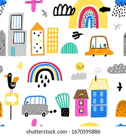 Childish seamless pattern with cute buildings, skyscrapers, rainbow, clouds. Good for kids fabric, textile, nursery wallpaper. Seamless city landscape. Kids pattern.