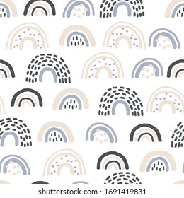 Childish seamless pattern with cute rainbow . Creative vector background for fabric, textile, nursery wallpaper.
