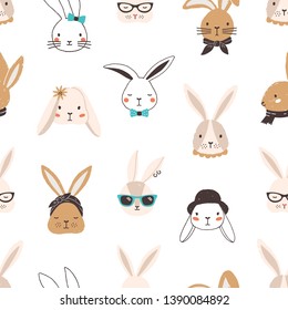 Childish seamless pattern with funny bunny faces on white background. Backdrop with cute rabbits or hares wearing glasses, sunglasses, hat, scarf, headscarf, bow tie. Flat cartoon vector illustration.