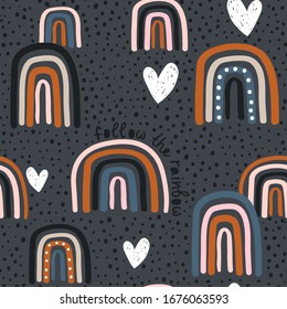 Childish seamless pattern with hand drawn rainbow, hearts and dots. Trendy kids vector background.