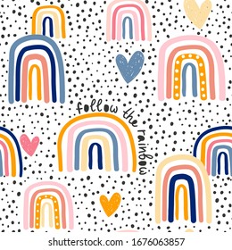 Childish seamless pattern with hand drawn rainbow, hearts and dots. Trendy kids vector background.