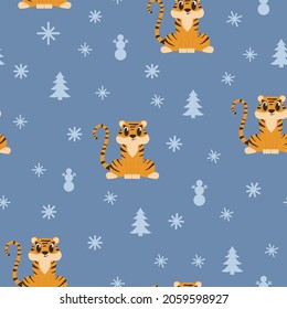 Childish seamless pattern with little tiger cub and snowflakes on blue. Christmas vector background. Perfect for kids apparel, fabric, textile, nursery decoration, wrapping paper