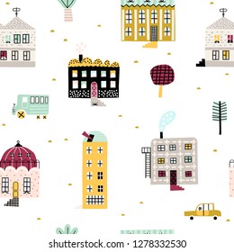 Childish seamless pattern with old buildings and cars. Good for kids fabric, textile, nursery wallpaper. Seamless city landscape. Cute pattern.