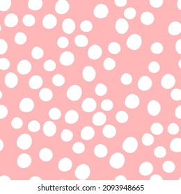 Childish seamless pattern, pastel colors. Hand drawn white dots on a pink background. Vector geometric backgrounds.