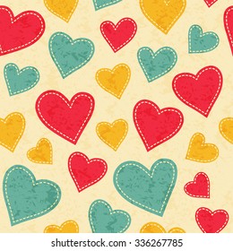 Childish seamless pattern with red, yellow and blue hearts. Hand-sewn style elements with white seams. Bright and happy color palette.