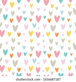 Childish seamless vector pattern with cute colorful hearts. Creative vector childish background for fabric, textile.