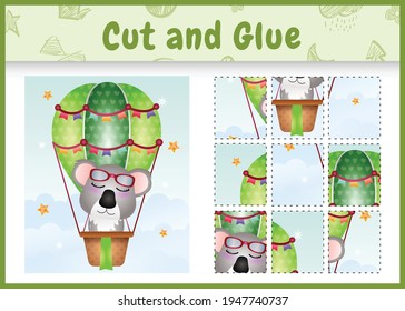 Children board game cut and glue with a cute koala on hot air balloon