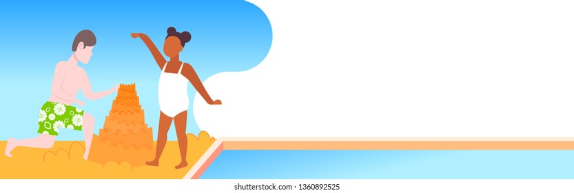 children building sandcastle on sea beach summer holidays concept boy and girl having fun playing with sand seaside flat horizontal banner full length