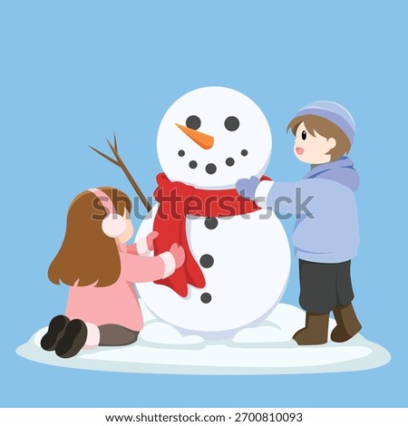 children building a snowman in winter