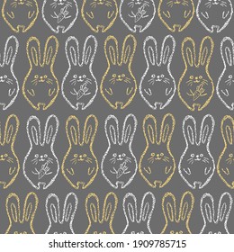Children drawing rabbits hand drawn wax crayons art on grey.Chalk Easter bunny background.  Crayon style funny bunny backdrop. Color oil pastel crayons freehand drawn rabbits. Fabric Easter texture.